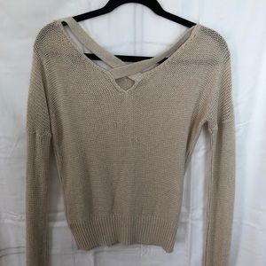 Knitted sweater with cross detail on back